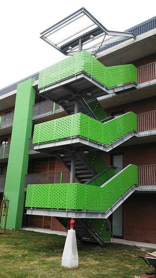 GALVANISED STAIRCASE WITH POWDER COATED PUNCHED ALUMINIUM CLADDED BALUSTRADES WITH ROOF STRUCTURE